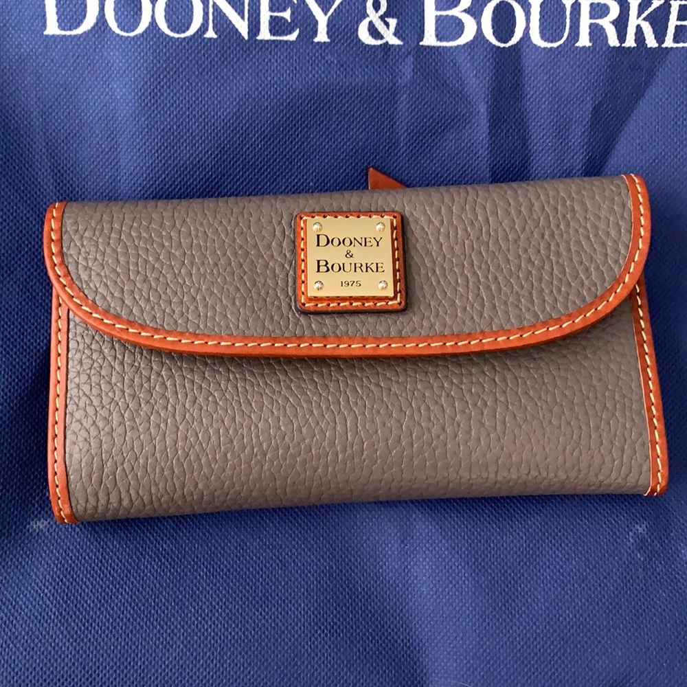 Dooney and Burke pebble grain continental clutch